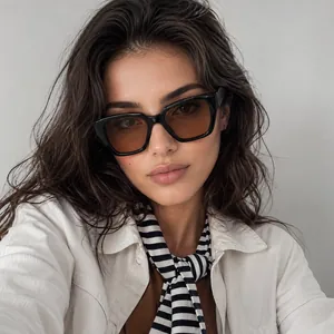 Close-up of black square frame sunglasses with amber lenses on model for a trendy look