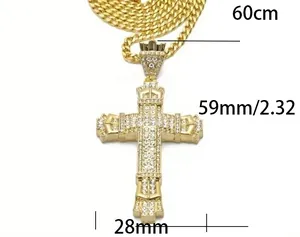 Detail of 60cm Cuban chain with a 59mm gold-plated iced-out cross pendant for men