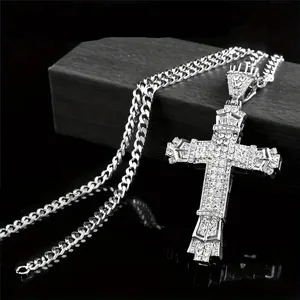 Iced out cross pendant on cuban chain with shiny silver metal and zircon stones