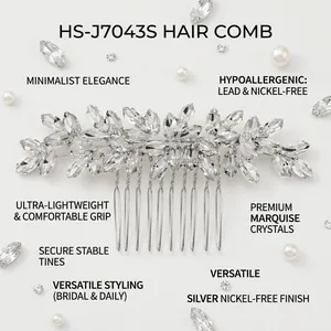 Macro shot of silver marquise crystal bridal hair comb with elegant leaf-shaped metalwork