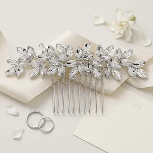 Silver bridal hair comb with leaf-shaped rhinestones on elegant satin and floral background