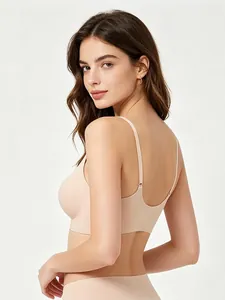 Detail view of seamless beige bra with U-back design and thin straps for comfort