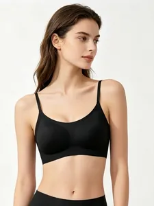Detail of a black seamless bralette with thin straps and a deep U-neckline for women