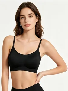 Detail of a seamless black bra with thin straps and wide band for comfort support