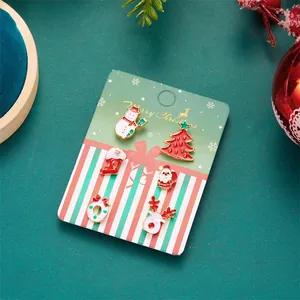 6-pack Christmas enamel stud earrings featuring Santa, snowman, and reindeer on a card