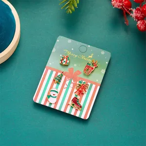 6-piece set of Christmas enamel stud earrings featuring Santa, deer, and snowman motifs