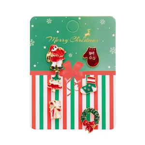 Set of 6 Christmas enamel brooches featuring Santa, Snowman and Deer on card