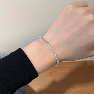 Detail of silver S925 tennis bracelet with 5A cubic zirconia on a female wrist