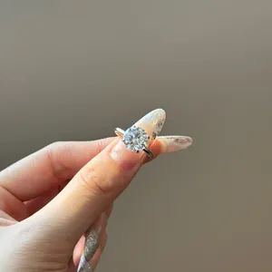 Macro shot of 925 silver solitaire ring with brilliant round cut cubic zirconia stone