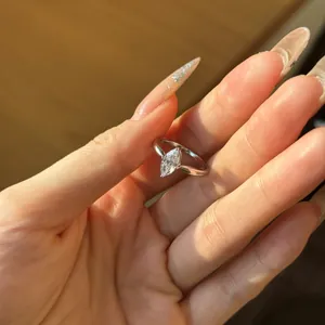 Close-up of a marquise-cut white zircon ring in silver-tone band for a modern look