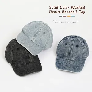 Solid color washed denim baseball caps for kids in black, light and dark blue tones