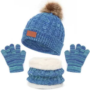 Winter knit set for kids with pompom hat, neck warmer, and gloves in blue-green mix