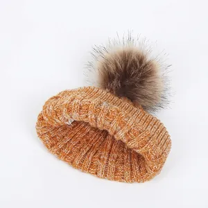 Toddler knitted beanie with large faux fur pompom in orange melange for winter