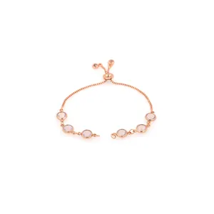 Bracelet ajustable en or rose avec six pierres roses rondes serties en clos poli