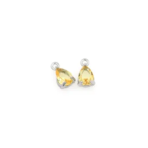 Macro detail of yellow pear-cut gemstone charms in 18K gold plated prong settings