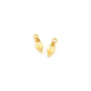 Detailed macro view of gold-plated marquise-cut yellow zircon charms for jewelry DIY