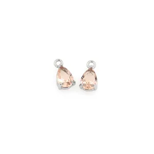 Detail of two teardrop champagne zircon charms in silver prongs for DIY jewelry