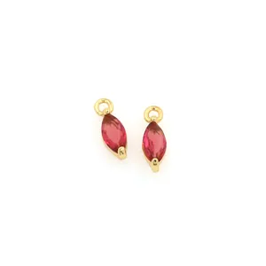Close-up of marquise-cut pink gemstone pendants with 18K gold plated prong setting