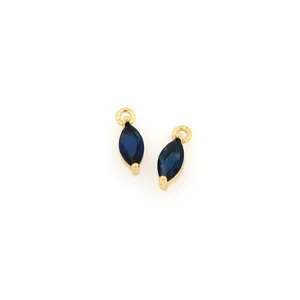 Detailed close-up of blue marquise-cut gems with 18K gold-plated claw settings for DIY jewelry