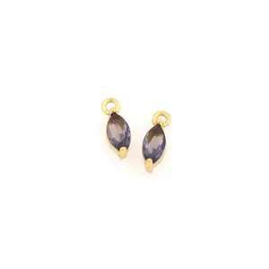 Macro view of 18K gold-plated marquise-cut purple gemstone pendants for DIY jewelry
