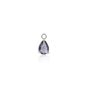 Macro shot of 18K gold-plated teardrop pendant with micro-set purple zircon and silver bail