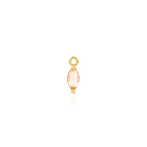 Macro view of a 18K gold-plated marquise-cut champagne gemstone pendant for DIY necklaces