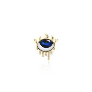 Detailed macro view of 18K gold-plated Evil Eye pendant with zircons and blue enamel