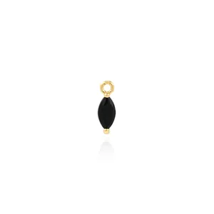 Macro shot of 18K gold plated marquise-cut black gemstone pendant with shiny finish