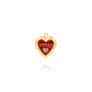 Macro detail of 18K gold-plated heart locket pendant with red enamel and Sweet engraving