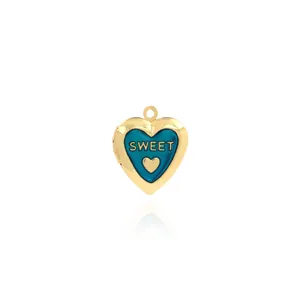 Macro shot of 18K gold-plated heart locket with blue enamel and Sweet engraving