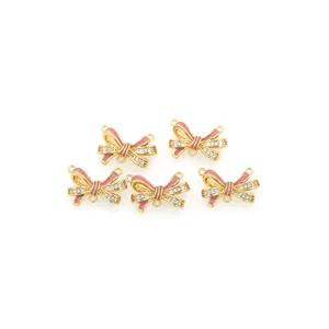 Pink enamel bow pendant in 18K gold-plated copper with zircon accents for DIY jewelry
