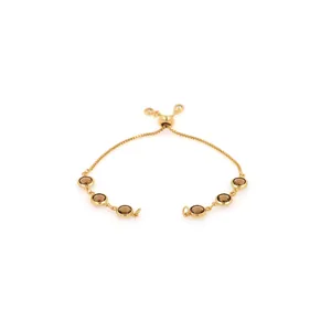 Detail of adjustable 18K gold-plated bracelet with six brown gemstones and sliding clasp