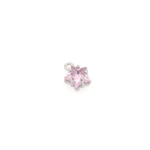 Close-up of pink star-shaped zircon pendant with 18K gold-plated prong setting