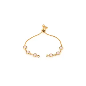 Detailed view of an 18K gold plated adjustable slider bracelet with pink gemstones