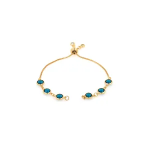 Detailed macro of 18K gold plated bolo bracelet with deep blue faceted crystals