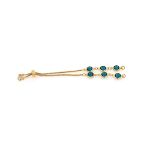Detail of adjustable 18K gold-plated slider bracelet with twin rows of blue crystals