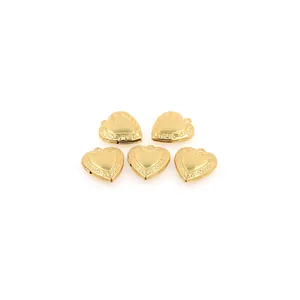 Five 18K gold plated heart locket pendants with vintage vine engraving on white background