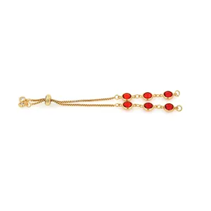 Detail of 18K gold-plated sliding bracelet with red zircon inlay and adjustable box chain