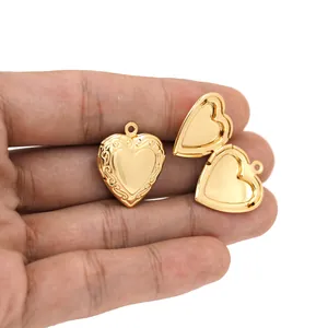 Close-up of 18K gold plated heart locket pendant with vintage floral border detail