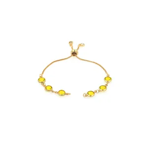 Detail of adjustable 18K gold plated slider bracelet with six yellow round gemstones