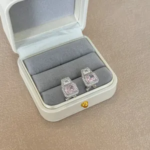 Detail of S925 silver halo earrings with ice-flower cut pink zircon and rectangular stones