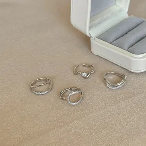 Detailed view of S925 sterling silver rings with irregular lines and zircon pavé setting