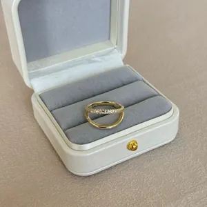 Detail of S925 silver double-layered gold ring with zircon pavé and inner hallmark