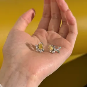 Detailed view of S925 silver earrings with cushion cut yellow zircon and water drop stones