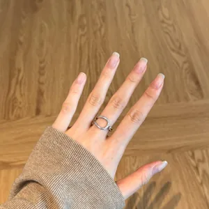 S925 silver double-layered open ring featuring irregular lines and white cubic zirconia