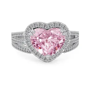 Pink heart-shaped halo ring with triple row pavé band in silver setting