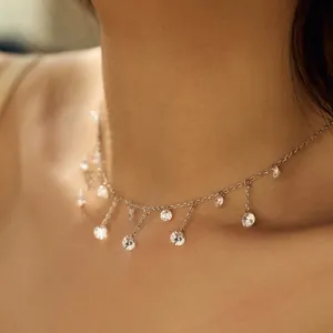 Elegant s925 silver fringe necklace with round zircon tassels on a female neck model