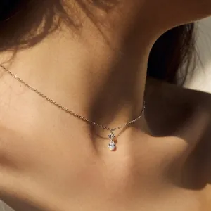 Elegant S925 silver necklace with round and teardrop zircon pendants on model neck
