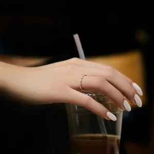 Elegant S925 sterling silver slim ring with fine diamonds shown in a lifestyle setting