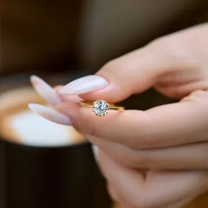 Detail shot of a s925 silver gold-plated ring with sparkling round zirconia stone
